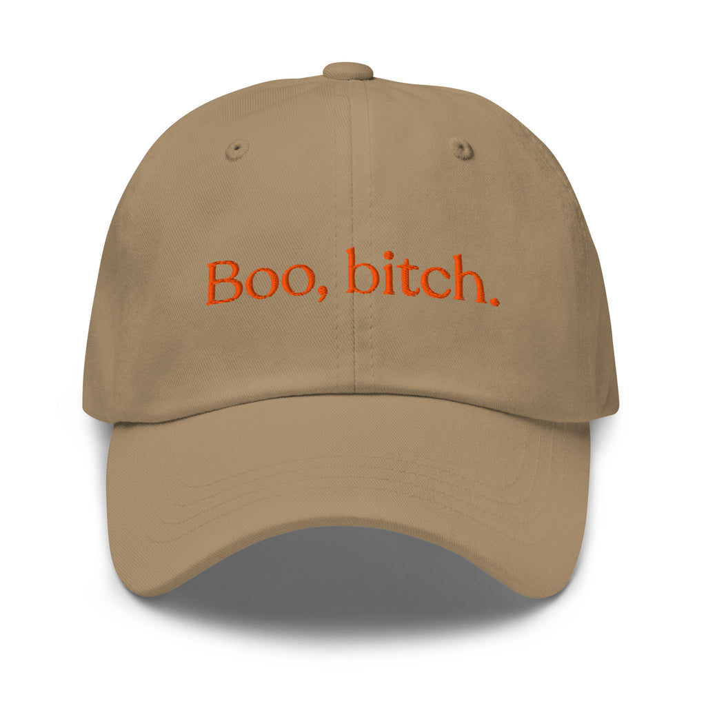 A tan baseball cap with orange embroidered text reading 'Boo, bitch.' on the front, shown against a plain white background.